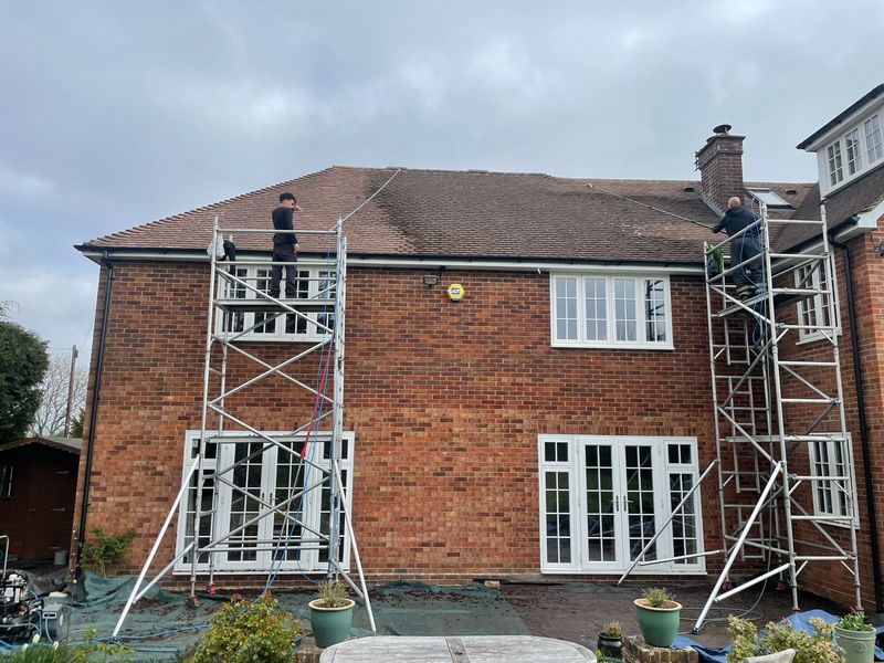 Roof cleaning carried out safely from scaffold towers by The Roof Moss Cleaners in {{TOWN}}